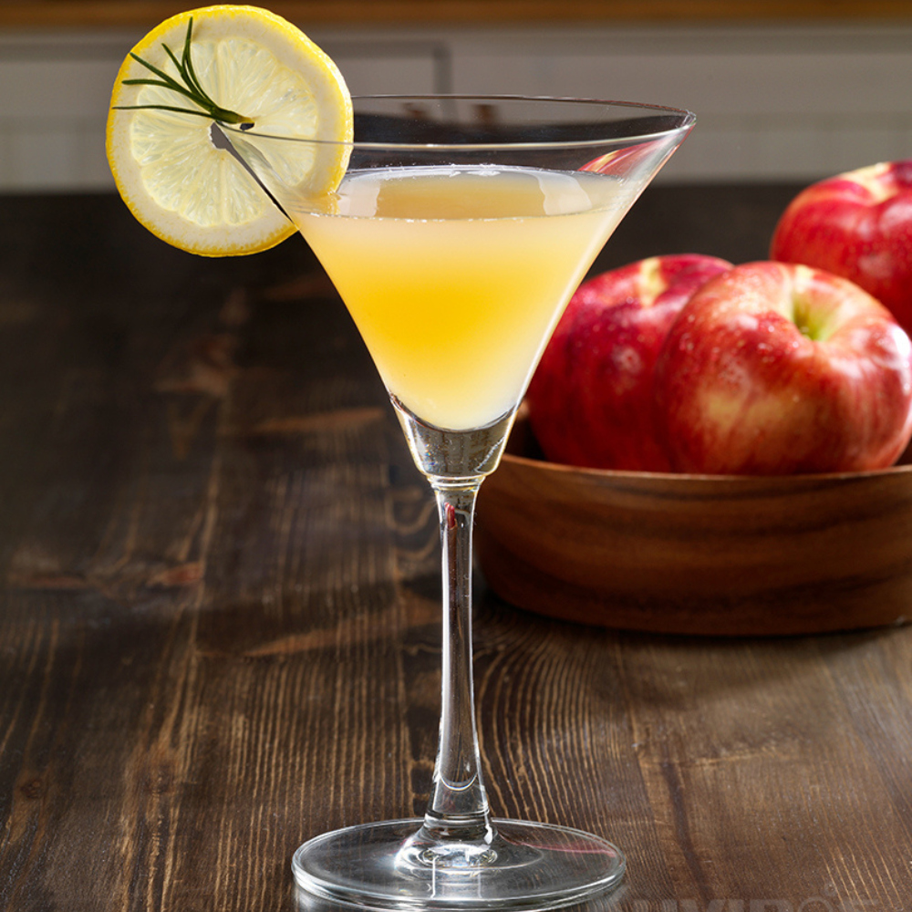 apple martini with a bowl of apples in the back