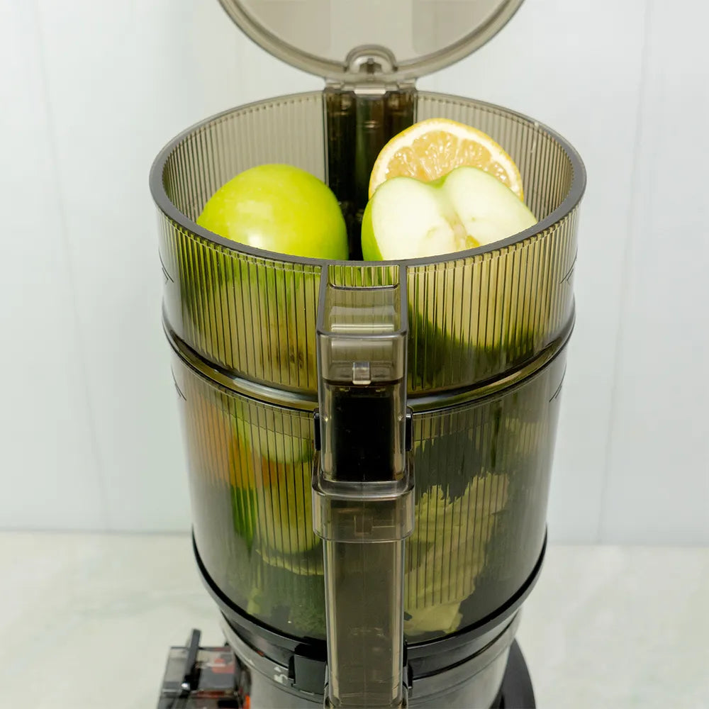 kuvings hands free slow juicer auto10 plus large hopper with apples and lime