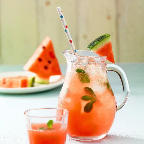 Two Watermelon Drinks in front of Watermelon slice 