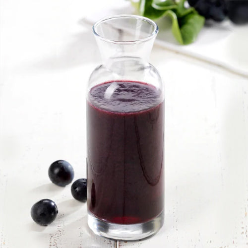 grape vegetable juice in glass bottle