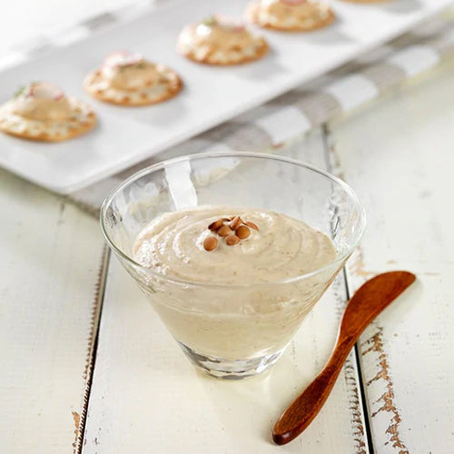 homemade hummus in glass bowl