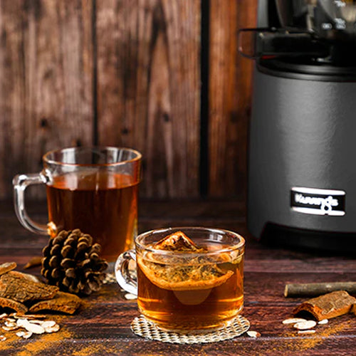 hot apple cider in mugs on a counter