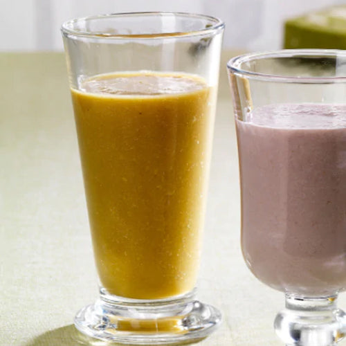 yellow and purple matcha juice in two glass cup