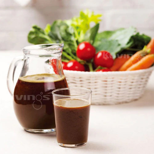 Multivitamin Juice in glass jar and cup