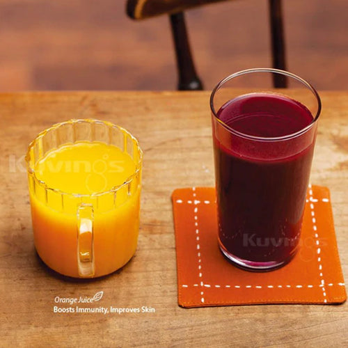 orange juice in a cup with handle