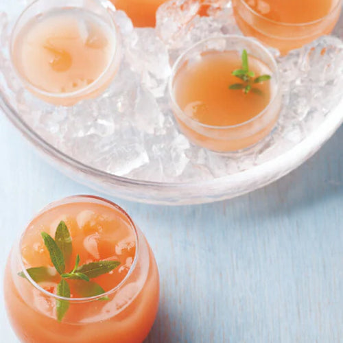 pink grapefruit ade in a glass cup with ice