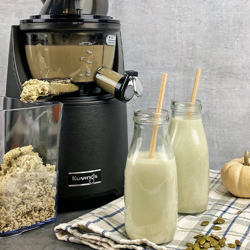 Pumpkin Seed Milk in two glass bottles