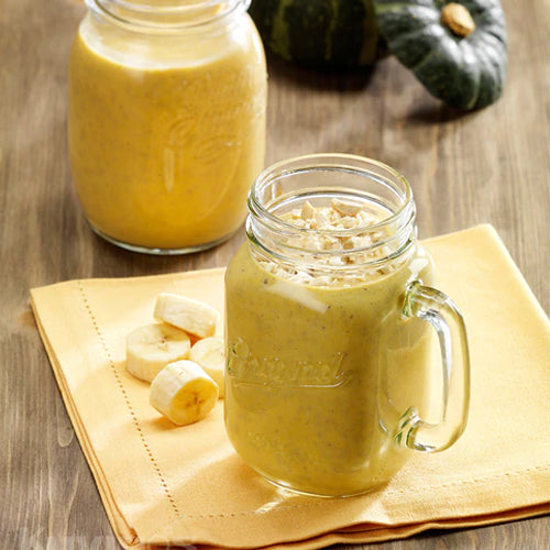 sweet pumpkin smoothie in a mason jar with handle
