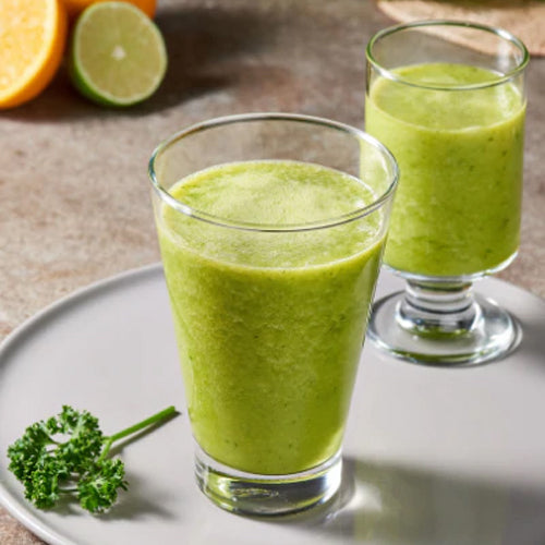 two glasses of green tropical smoothie