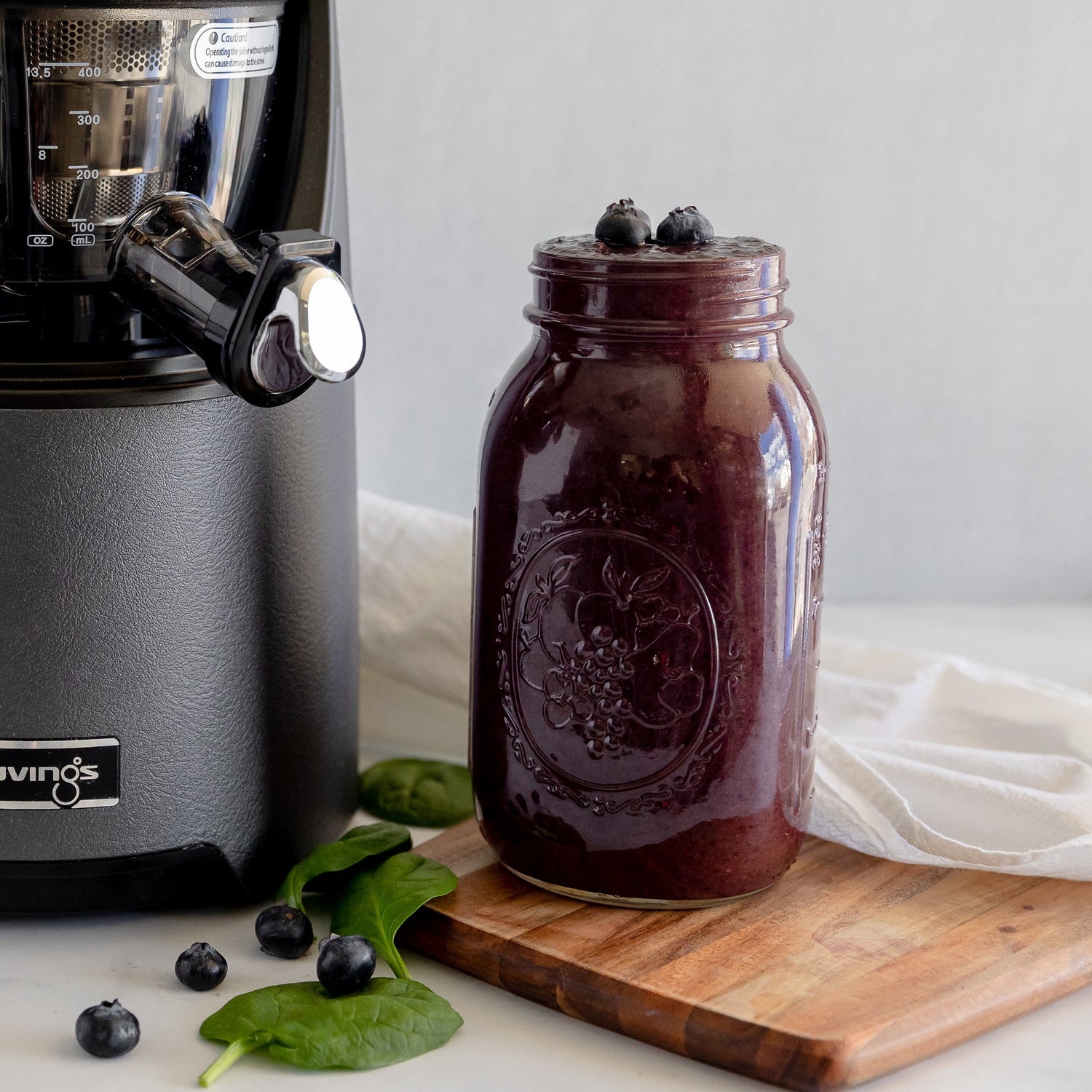 blueberry avocado smoothie next to juicer
