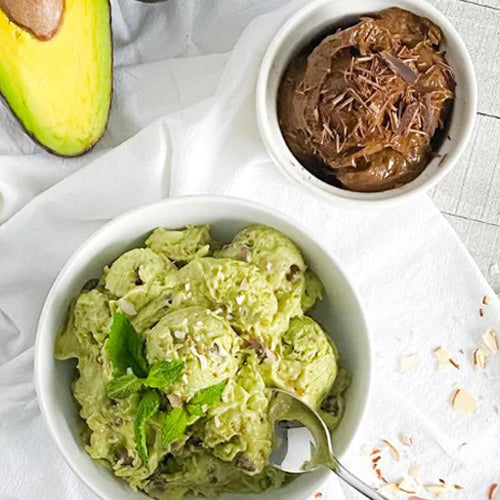 Avocado ice cream in white bowls.