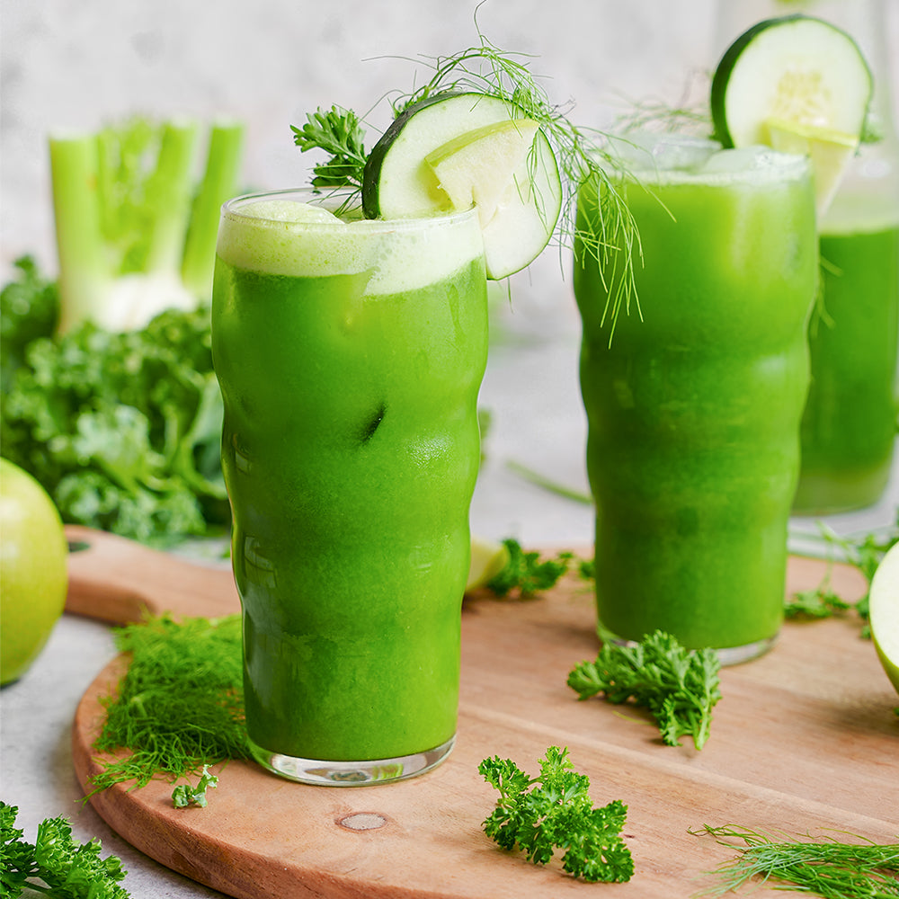 Green juice made of cucumber, apple, fennel, kale, and parsley