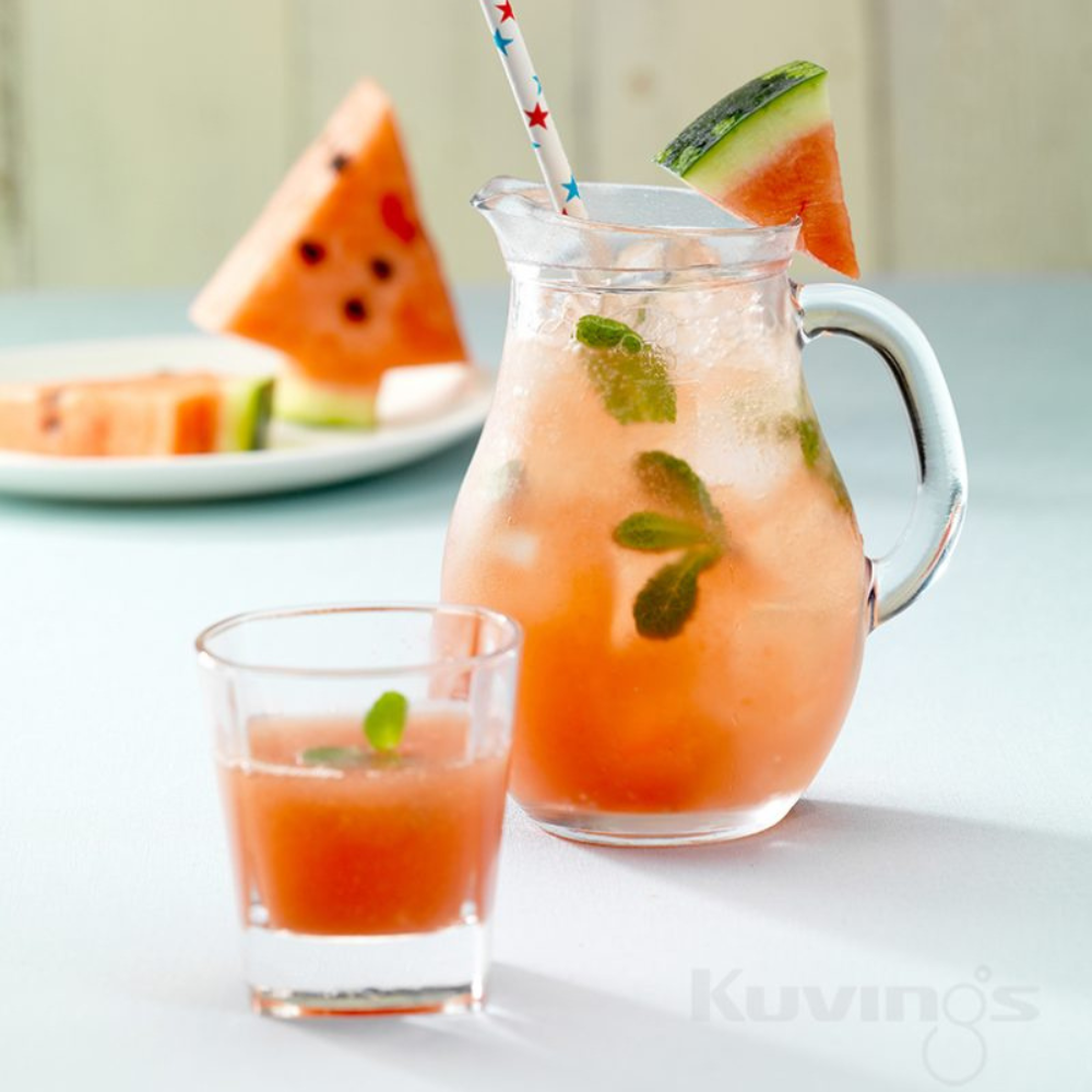 mint watermelon lemonade in a pitcher and glass