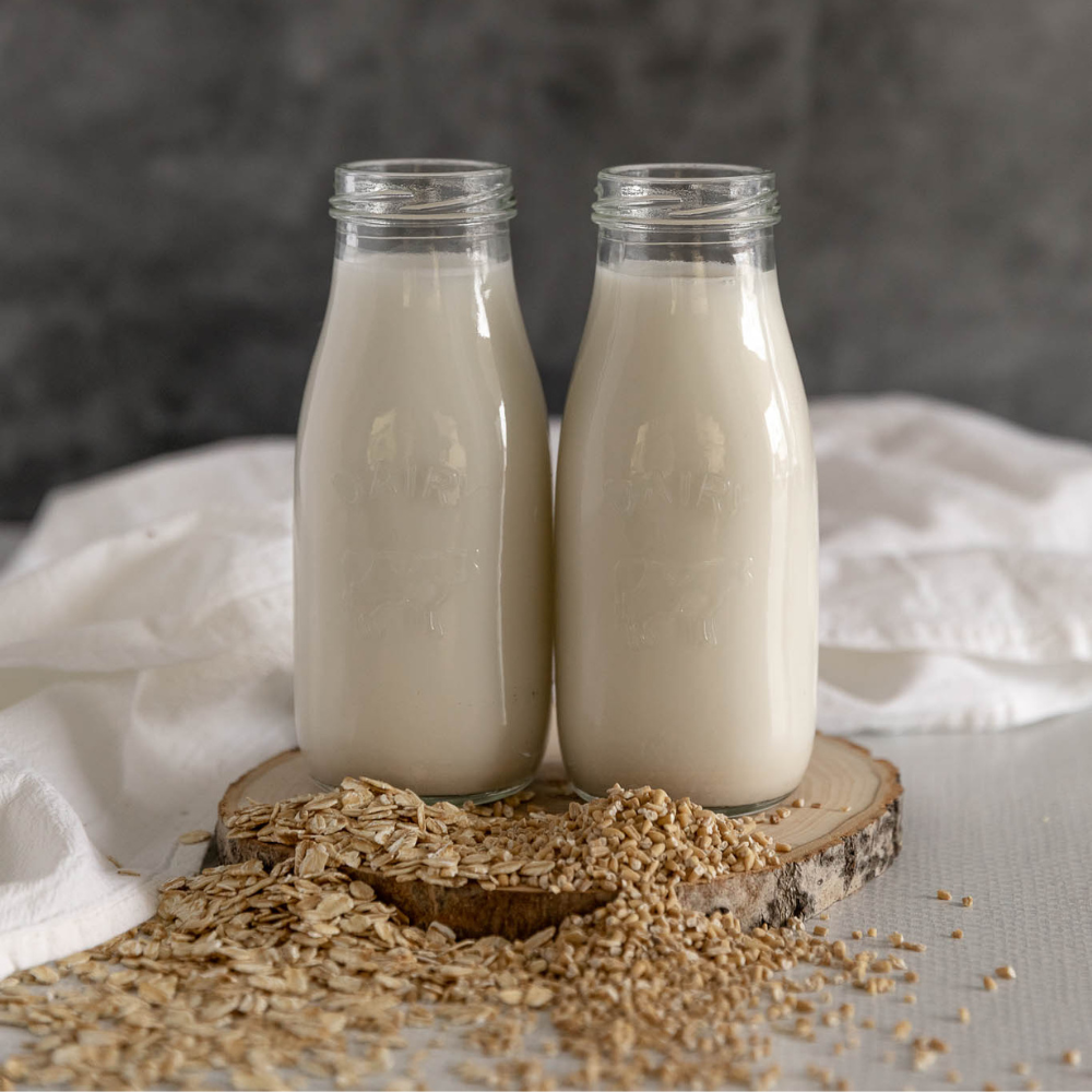 2 bottles of oat milk made with steel cut oats and rolled oats