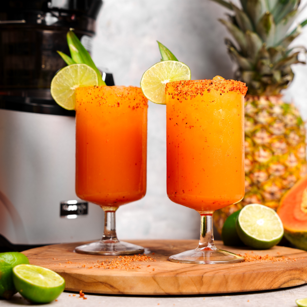 pineapple papaya lime juice in 2 glasses