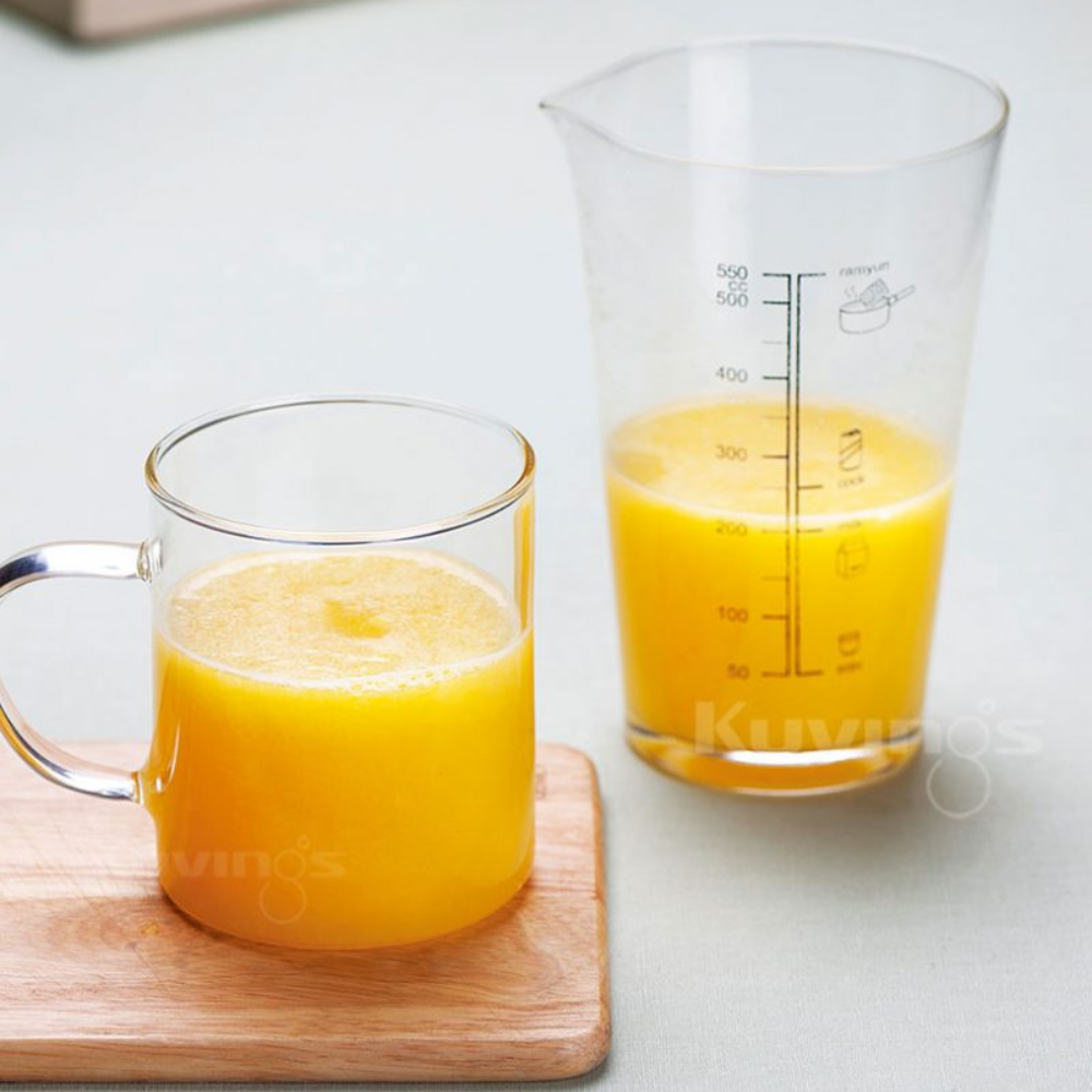 soothing pear ginger juice in a measuring glass and cup