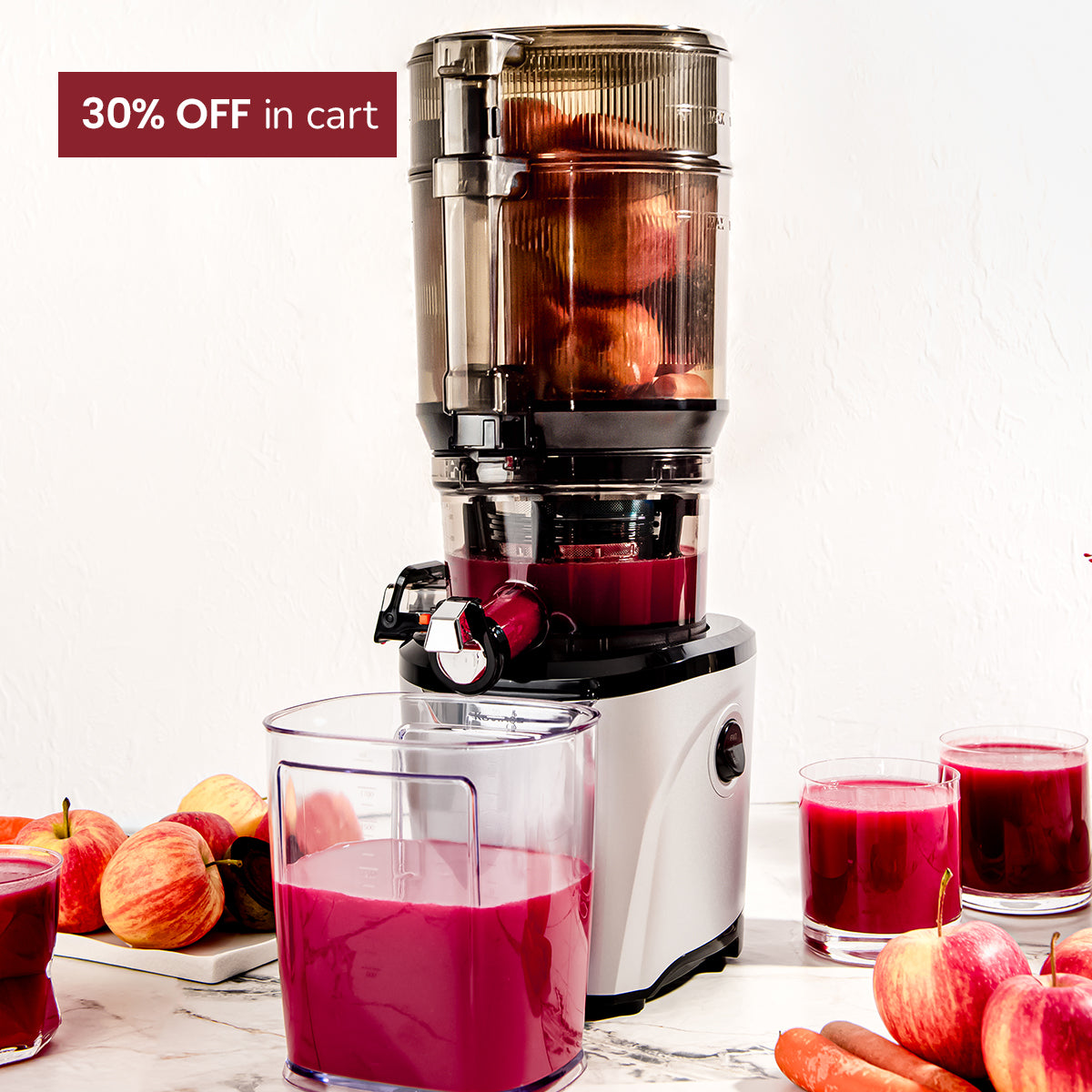 auto10 Juicer with fruits and glasses of juice on a white background, with a 30% off cart label.